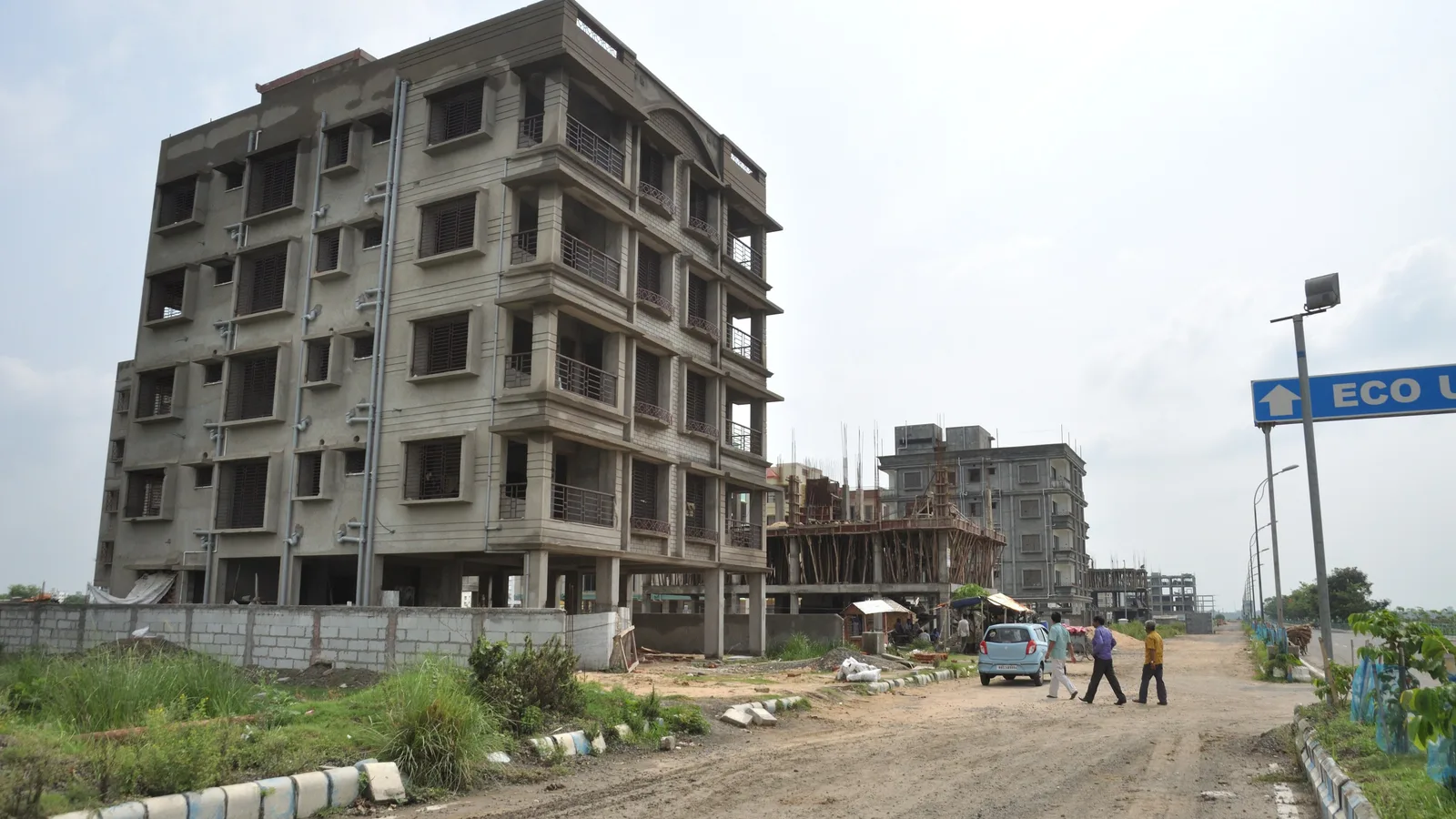 New apartment blocks under construction beside a road in Rajarhat, Kolkata